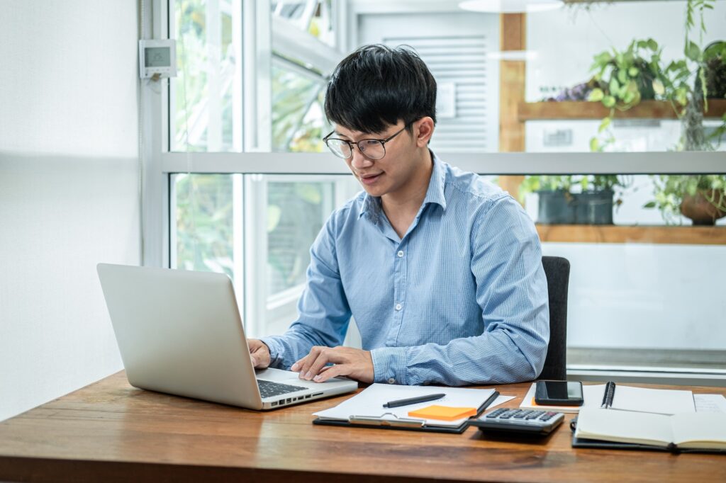 Businessman talking a video conference about financial planning of new business with colleague