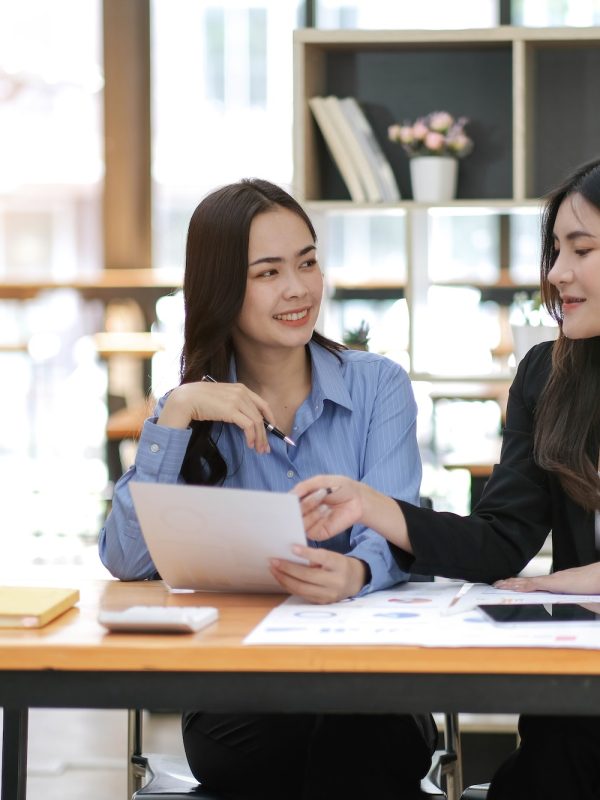 Asian business adviser meeting to analyze and discuss the situation on the financial