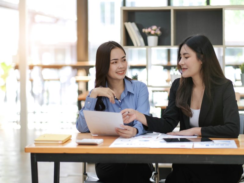 Asian business adviser meeting to analyze and discuss the situation on the financial