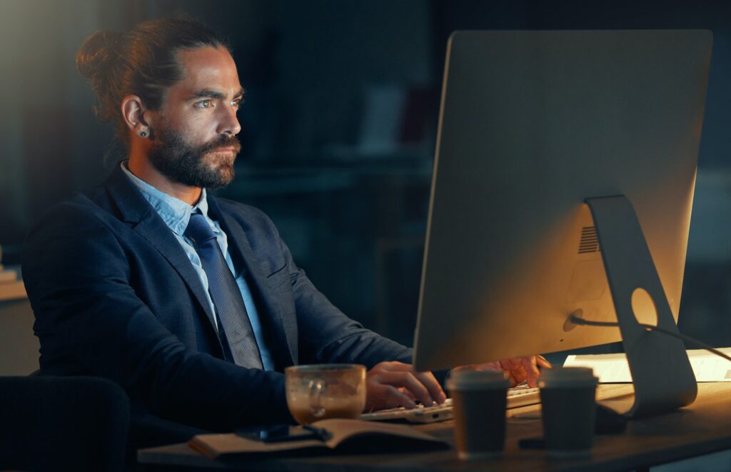 Tech, software and computer web design worker working at night on cyber security, programming or co