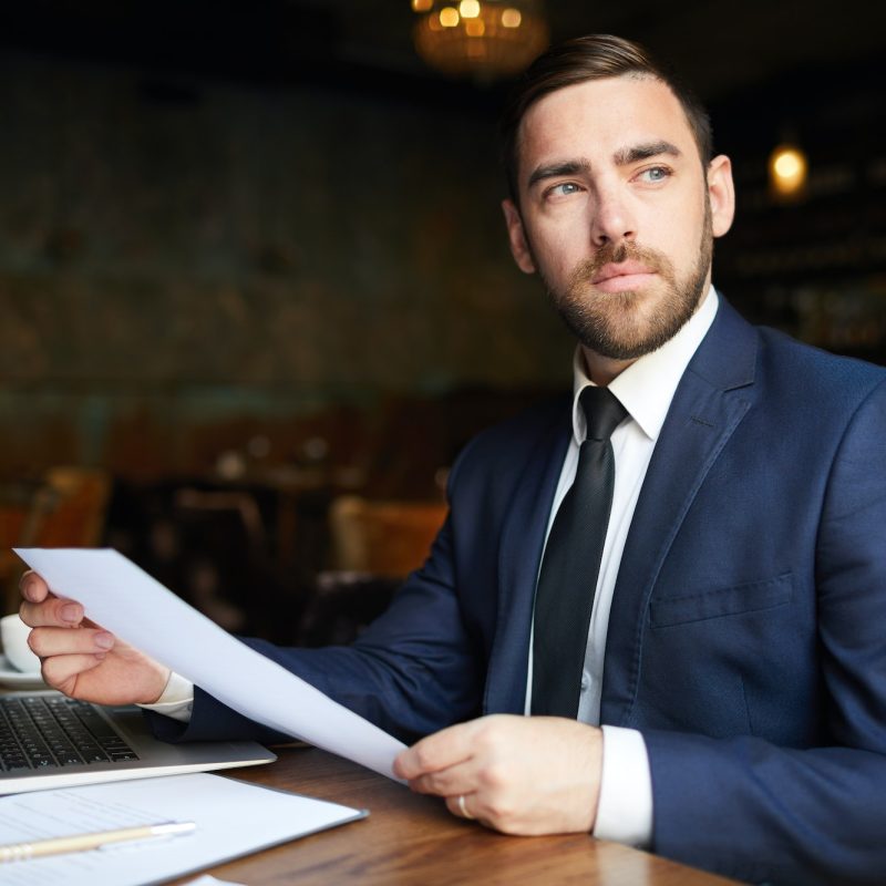 Successful business consultant with papers