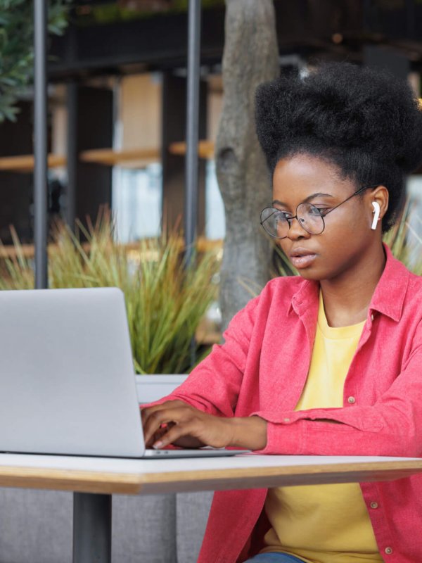 a designer or programmer with a laptop. a beautiful woman copywriter or social media specialist