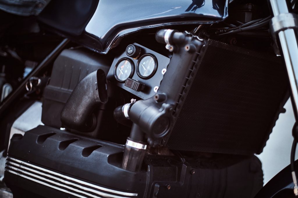 Close-up photo of a custom-made motorcycle fuel tank with sensors.