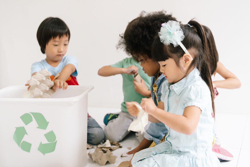 Group of adorable kids school kindergarten learning biology recycle environment in classroom.
