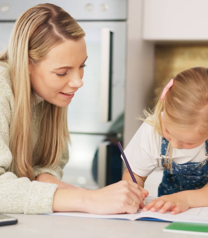 Education, mother and learning child writing or drawing for kindergarten school homework or project
