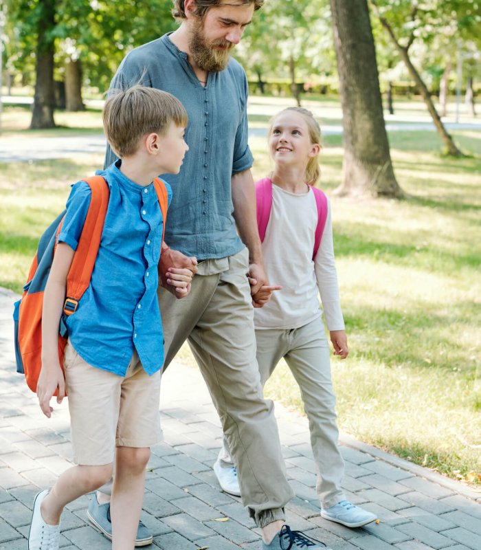 Father walking kids to school