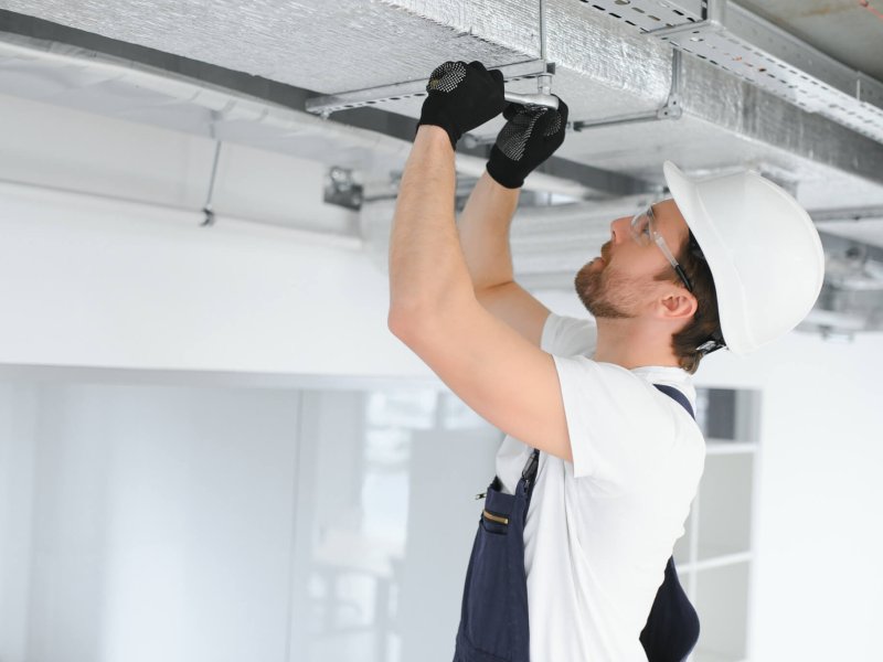 ventilation system installation and repair service. hvac technician at work. banner copy space