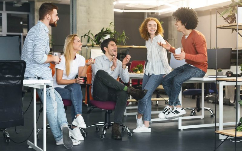 friendly-business-team-talking-at-coworking-space