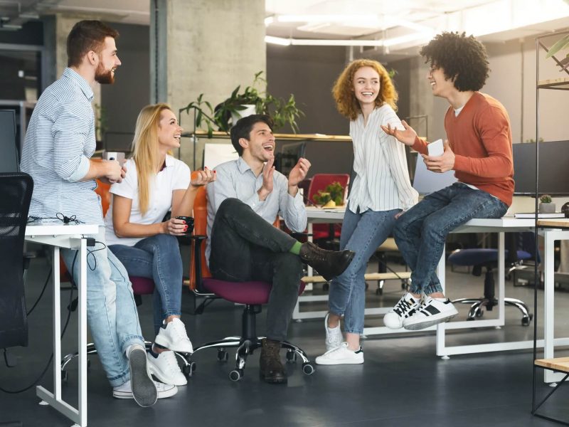 friendly-business-team-talking-at-coworking-space