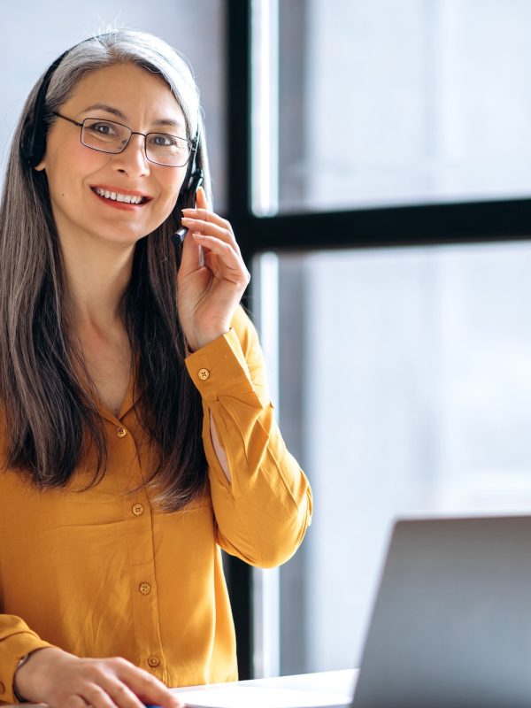 asian woman business online meeting virtual laptop mature