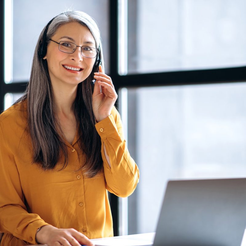 asian woman business online meeting virtual laptop mature