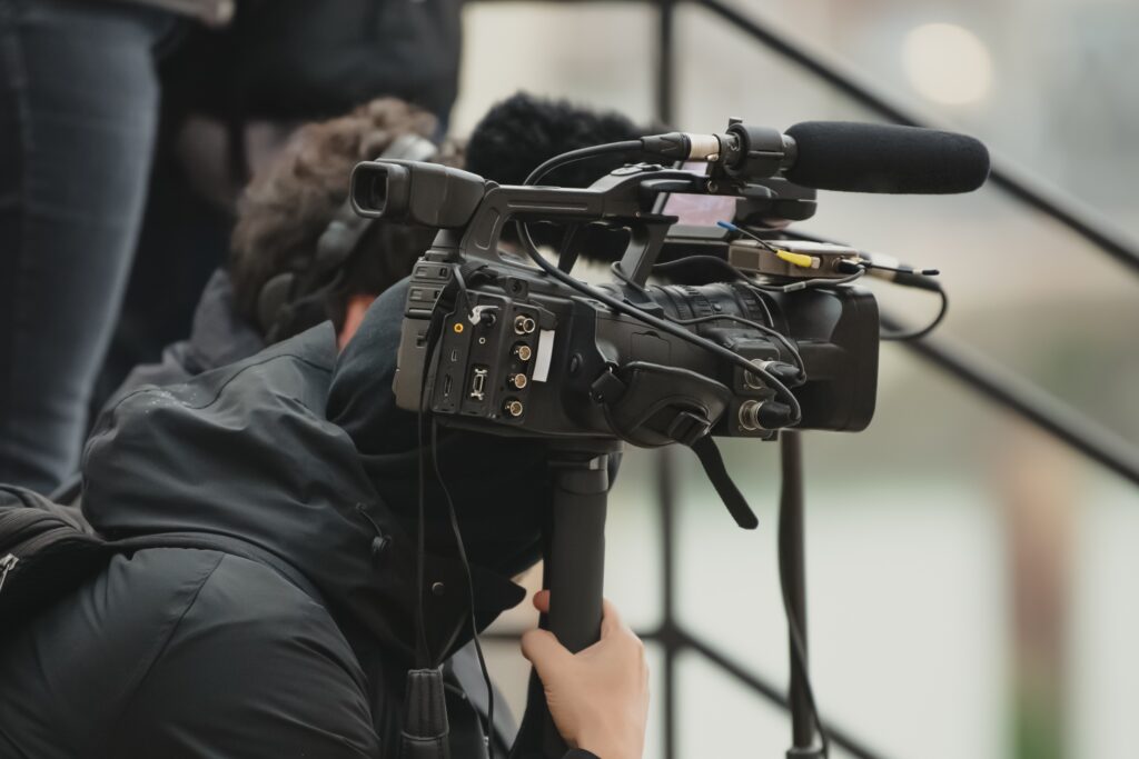 Videographer holding a video camera