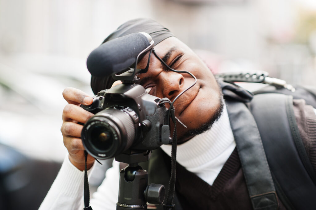 Young professional african american videographer